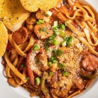 Jambalaya Pasta · Gulf shrimp, chicken, smoked sausage, onions, peppers and mushrooms in a spicy creole sauce ...