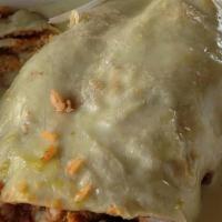 Enchilada Burritos · Topped with red enchilada sauce and cheese.