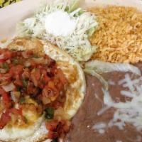 Huevos Rancheros · Three sunny side up eggs topped with grilled onion, tomato and jalapeño peppers.