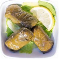 Side Grape Leaves · Leaves from a grape vine stuffed with rice and spices. Vegan. 3 pieces come with each side.