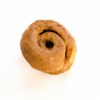 Quinnamon - Maple · Our hundred layer dough rolled in cinnamon sugar, baked, topped with maple glaze and a dusti...