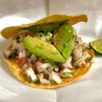 Fish Tostada (Ceviche) · Served on a corn Hard Shell... Fish mixed with pico de gallo topped with avocado