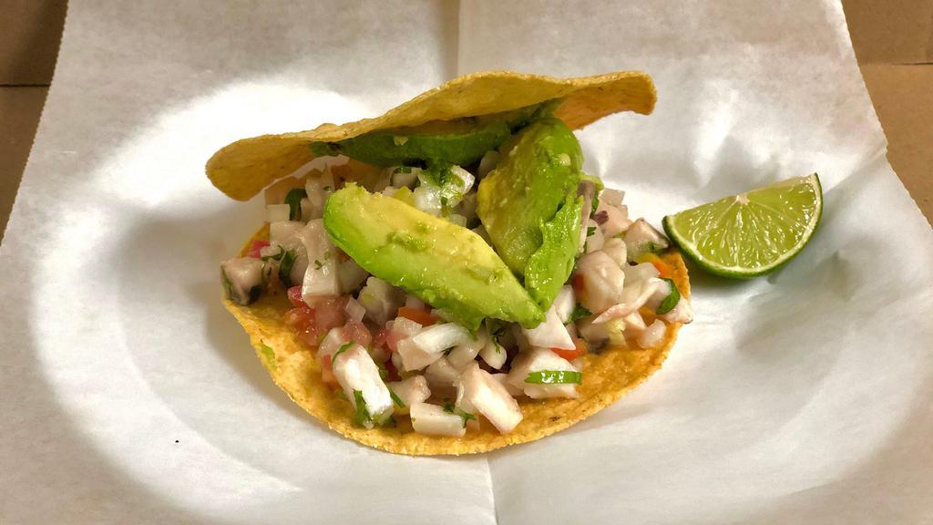 Fish Tostada (Ceviche) · Served on a corn Hard Shell... Fish mixed with pico de gallo topped with avocado