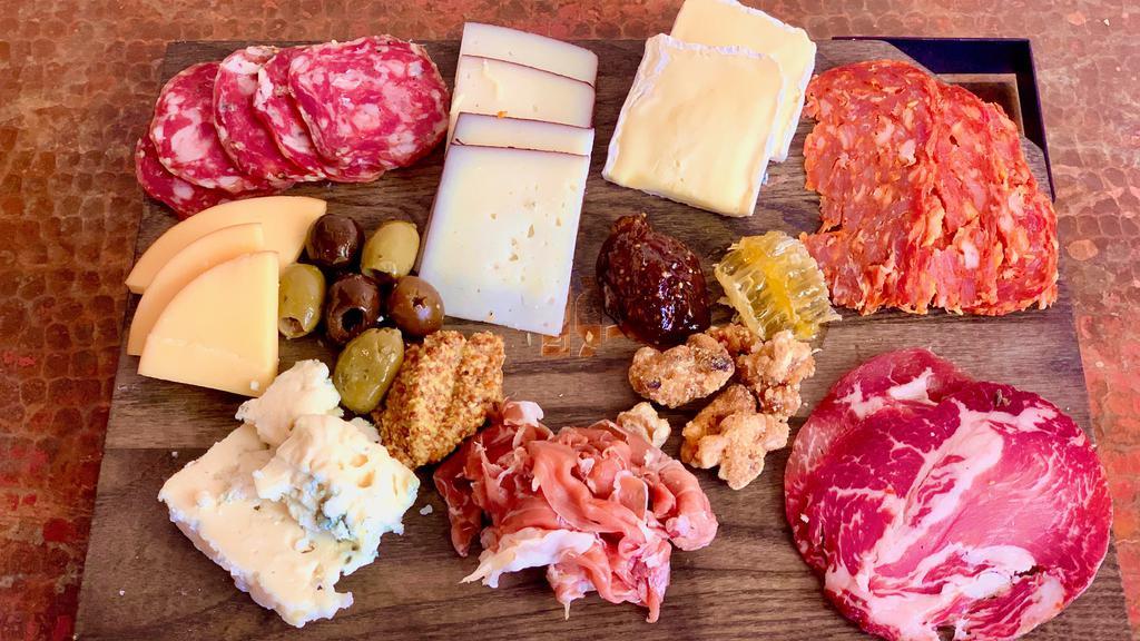 Cheese & Charcuterie - Large · Chef’s choice of artisanal cheeses and meats, served with crostini, fig preserve, candied nuts, honeycomb and olives.