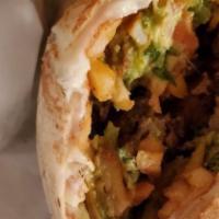 Burrito California · Tortilla de harina con guacamole, queso, papas fritas, crema, y su selección de carne / flou...