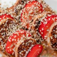 Fig Toast · Local flax bread topped with almond butter and toasted golden brown. Layered  with sliced or...
