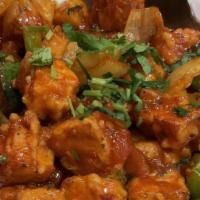 Chili Paneer · Fried cheese cubes, onion, and bell pepper tossed with sauce.