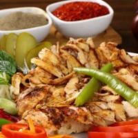 Chicken Shawarma · Boneless, and skinless chicken breast an thigh meat, marinated over night, and cooked on a v...