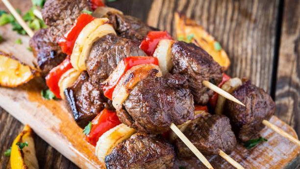 Beef Kebabs · Two skewers of tender ribeye steak tips, seasoned to perfection.