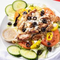 Grilled Chicken House Salad · Lettuce, tomatoes, onions, green peppers, and cucumber topped with mixed cheese with your ch...