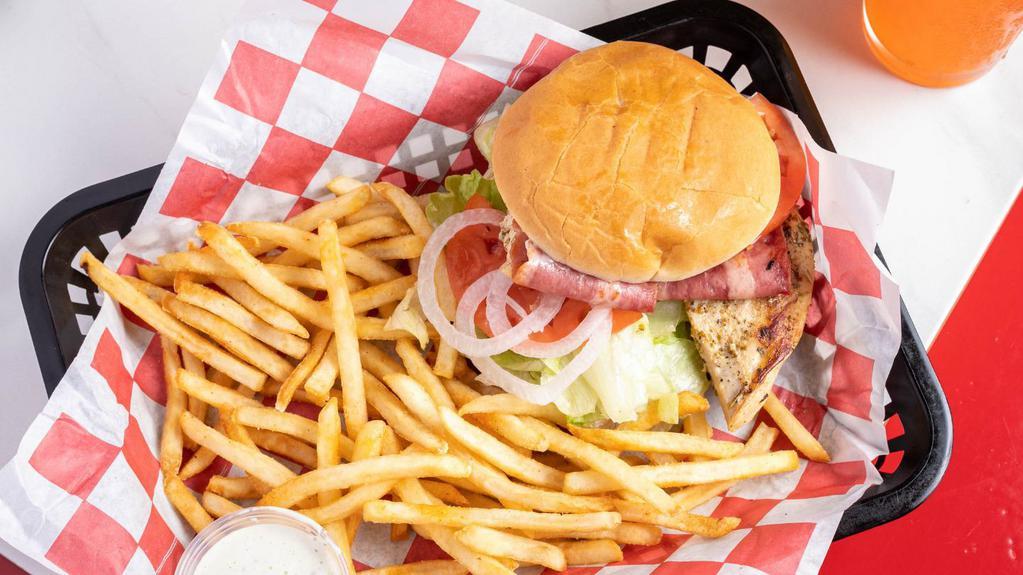 Grilled Chicken Sandwich · Served with mayo, lettuce, tomato, red onions and pickles.