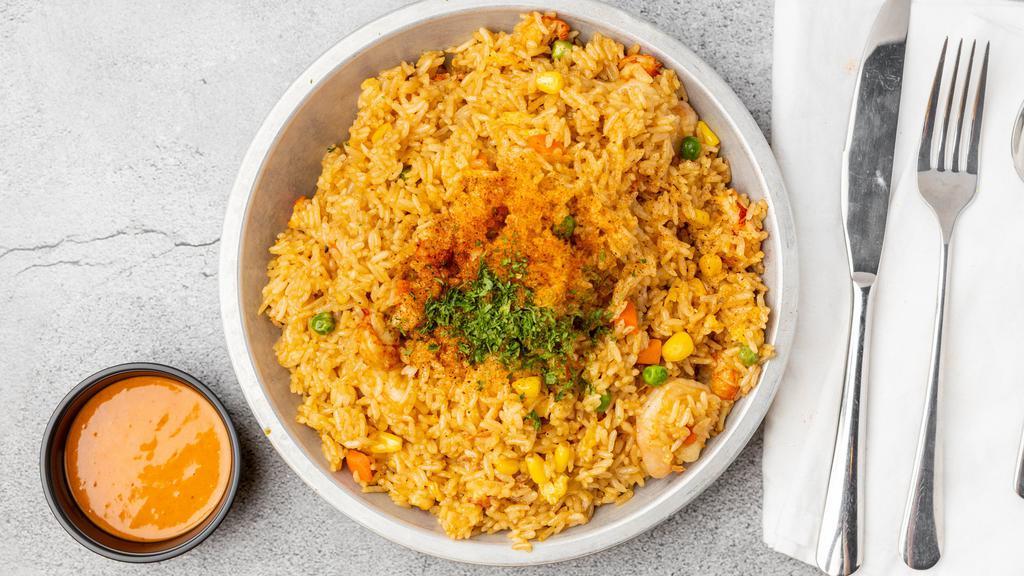 Cajun Crawfish Fried Rice · Crawfish screams cajun and this dish is no exception. Fried rice perfection with a kick of cajun spices and crawfish tails. Served with a side a voodoo sauce. A little bit of cajun, a little bit of Asian, and all kinds of perfection.