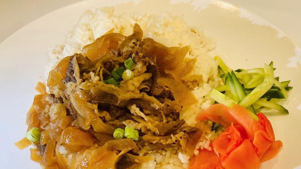 Gyudon Beef Bowl · Japanese dish consisting of a bowl of rice topped with beef and onion simmered in a mildly sweet sauce flavored with dashi (fish and seaweed stock), soy sauce and mirin (sweet rice wine).
