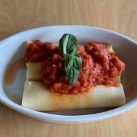 Cheese Manicotti · Pasta rolls stuffed with ricotta and mozzarella, topped with marinara sauce and baked with m...