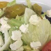 Greek Salad · Iceberg, feta cheese, kalamata olives, onions, cucumbers, banana peppers, tomatoes, and pepp...