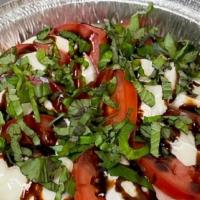 Fresh Mozzarella & Tomato Salad · Fresh mozzarella cheese, tomatoes, and fresh basil. Drizzled with olive oil and balsamic.