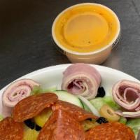Small Antipasto Salad · Lettuce, onions, provolone cheese, ham, salami, and pepperoni. Served with Italian dressing.