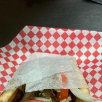 Lamb Gyro Sandwich · Comes with lettuce, tomatoes, onions, and cucumber sauce on pita.