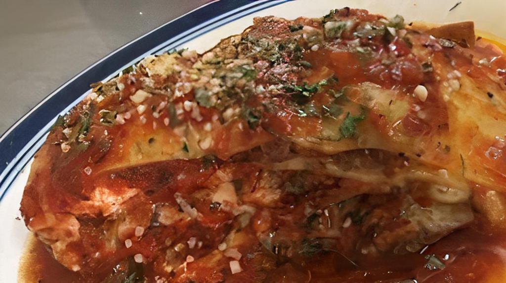 Lasagna · home made comes with meat, Mozzarella and Ricotta Cheese, Served with bread and salad.