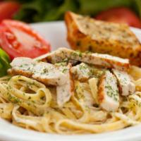 Grilled Chicken Fettuccine Alfredo · Juicy grilled chicken fettuccine pasta over fresh alfredo sauce with freshly baked breadstic...