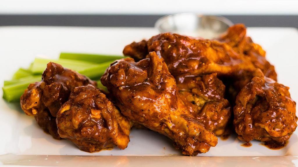 4 Bone-In Wings · Our wings are served with Ranch or Blue Cheese dressing, celery and either our<br />house made Medium, Hot, or Scorpion Sauce, Plain, Old Bay, Carolina Gold<br />BBQ Sauce, Garlic Parm or Lemon Pepper
