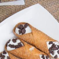 Chocolate Cannoli · Tube-shaped chocolate shells of fried pastry dough dipped in chocolate, filled with a sweet,...