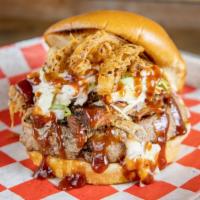 Big Bbq Burger · 1/2 pound, seasoned angus beef burger topped with smoked Pulled Pork, homemade Slaw, Fried O...