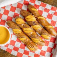 Pretzel Sticks & Beer Cheese · In house beer cheese that is so good you'll slap your momma.