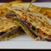 Quesadilla Stacked Burger · Two juicy burgers on a crispy flour tortilla with pico de gallo, melted cheddar, monterrey j...