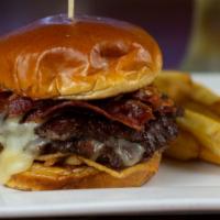The Daddy Mack Double Stack · Two juicy burgers, housemade bacon jam, pepper bacon, melted monterey jack, and mayo on a bu...