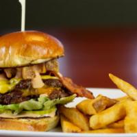 The Hot Mess  · Two stacked burgers on a buttered brioche bun with bacon, cheddar and American cheeses, thic...