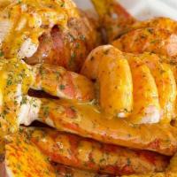 Qc Lobster Special · 1 Lobster tail, 1 cluster, 5 shrimp, boiled egg,  corn, and potatoes; topped with garlic but...