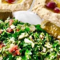 Neomonde Plate · Tabouli, Hummus, Baba Ghanouj, 2 Grape Leaves, a ramekin of Labneh, a drizzle of EVOO, and K...