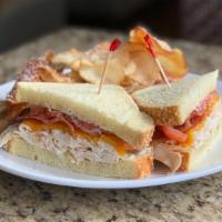 Chicken & Cheddar Panini · Sliced roasted chicken breast with applewood smoked bacon, cheddar cheese, tomato, and herb ...