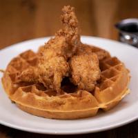 Chicken & Waffle · Traditional belgian waffle topped with buttermilk fried chicken tenders and honey buerre Bla...