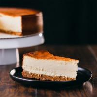 New York Cheesecake · Smooth and creamy New York style cheesecake in a graham cracker crust.