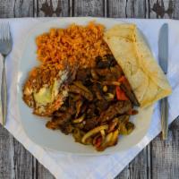 Fajitas · Grilled steak, bell peppers, onions, and tomatoes. Served with rice, beans, salad, and torti...