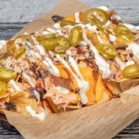 Bbq Nachos · Choice of chicken or pork on house made tortilla chips covered in beer cheese, diced onions,...