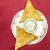 Meat Samosa · Two pieces. Crispy fried turnovers filled with ground lamb.
