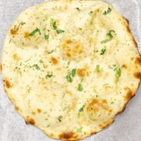 Garlic Naan · Leafed bread topped with freshly chopped garlic, cilantro and baked in clay oven.