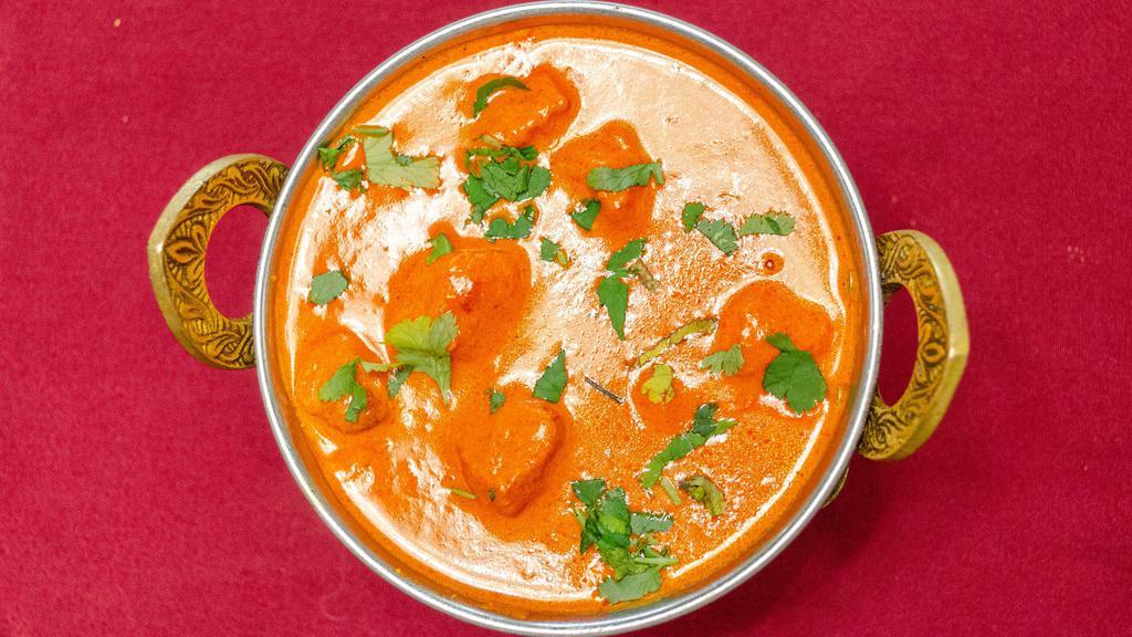 Chicken Tikka Masala · Tender boneless chicken breast, cooked in a tomatoes and butter sauces.