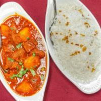 Lamb Vindaloo · Fresh tender lamb or goat with potato cooked in a light, ginger garlic, and tomato puree.