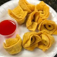 Fried Wonton (8)炸云吞 · Served with sweet and sour sauce on the side.