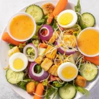 House Salad · Mixed greens, tomato, cucumber, onion, egg, cheddar-jack cheese, carrots and croutons.