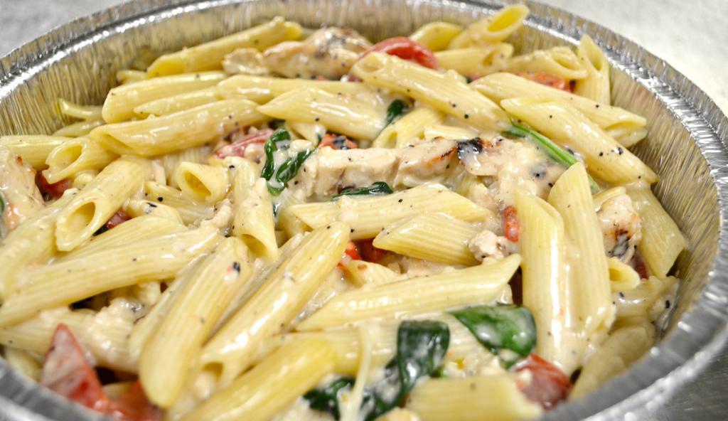 Tuscan Chicken · Grilled chicken sautéed in extra virgin olive oil, roasted peppers, spinach, garlic, tossed in Alfredo sauce with your choice of pasta.