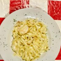 Seafood Al' Amedeo · Sautéed shrimp and scallops tossed with our homemade Alfredo sauce and served over a bed of ...