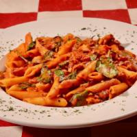 Chicken Rustico · Grilled chicken breast sauteed with ziti pasta, fresh spinach and roasted red peppers in a h...