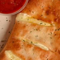 Calzones · Mozzarella and ricotta cheese with choice of 1 topping, served with a side of homemade marin...