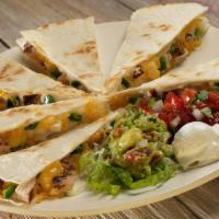 Chicken Quesadilla · Grilled chicken, Cheddar Jack cheese, bell peppers and onions grilled in a flour tortilla. S...