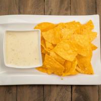 Queso & Chips · Homemade Queso and fresh corn chips.
